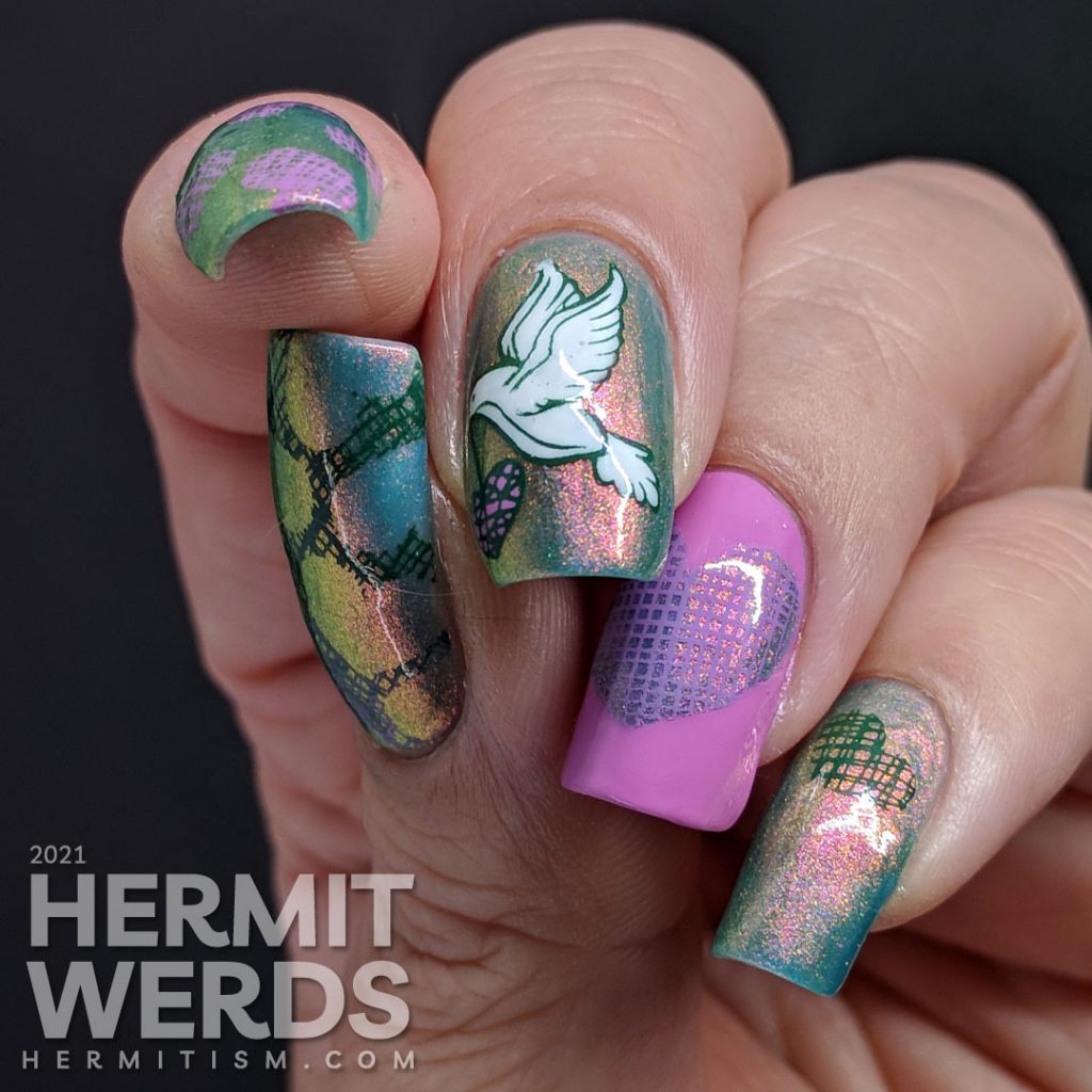 A pink to green shimmery base polish covered with soft green, purple-pink, and white stamping decals of a dove and crosshatch hearts.