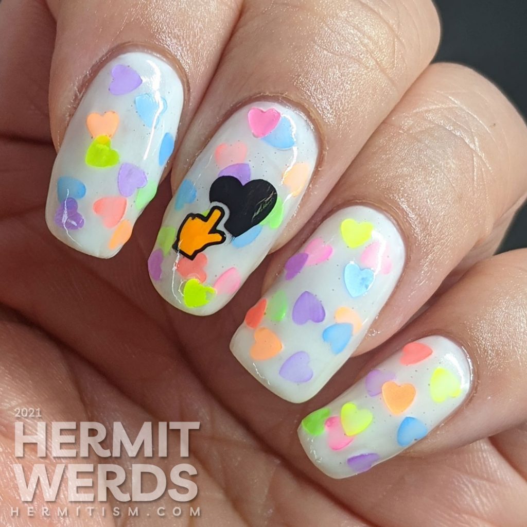 A white jelly pond mani with a neon rainbow of fluorescent heart sequins. Glow-y black light photos included.