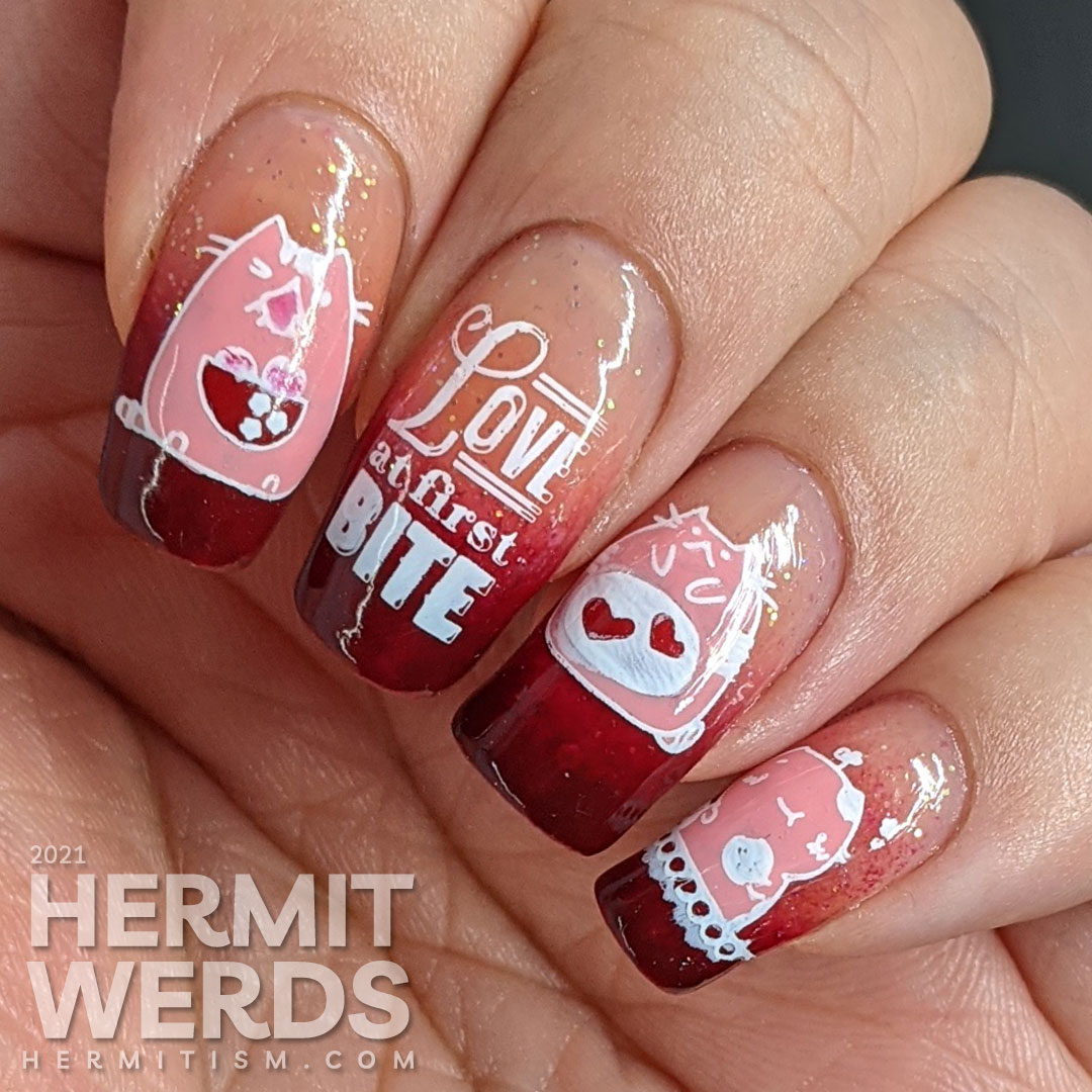 A dark burgundy to nude with glitter baby boomer French tip with silly hungry cat stamping decals on top and "Love at first bite" nail art.