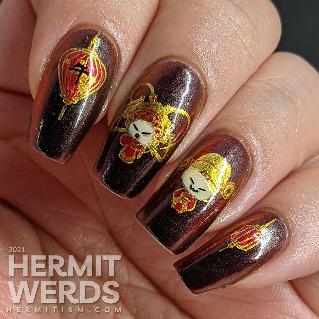 Year of the Ox nail art on a black/red/gold multichrome base with chibi Chinese opera performers, lanterns, and ox symbols.