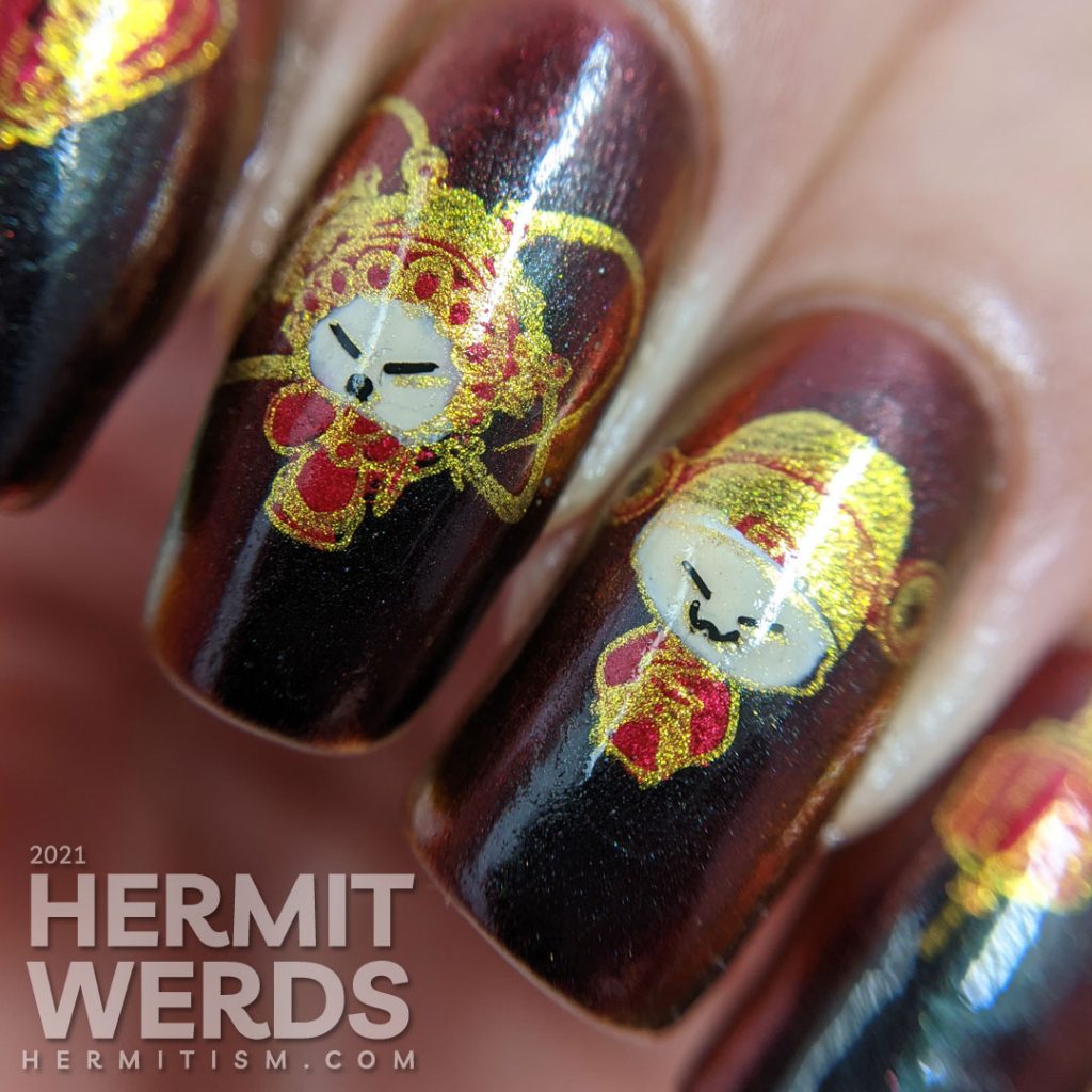 Year of the Ox nail art on a black/red/gold multichrome base with chibi Chinese opera performers, lanterns, and ox symbols.