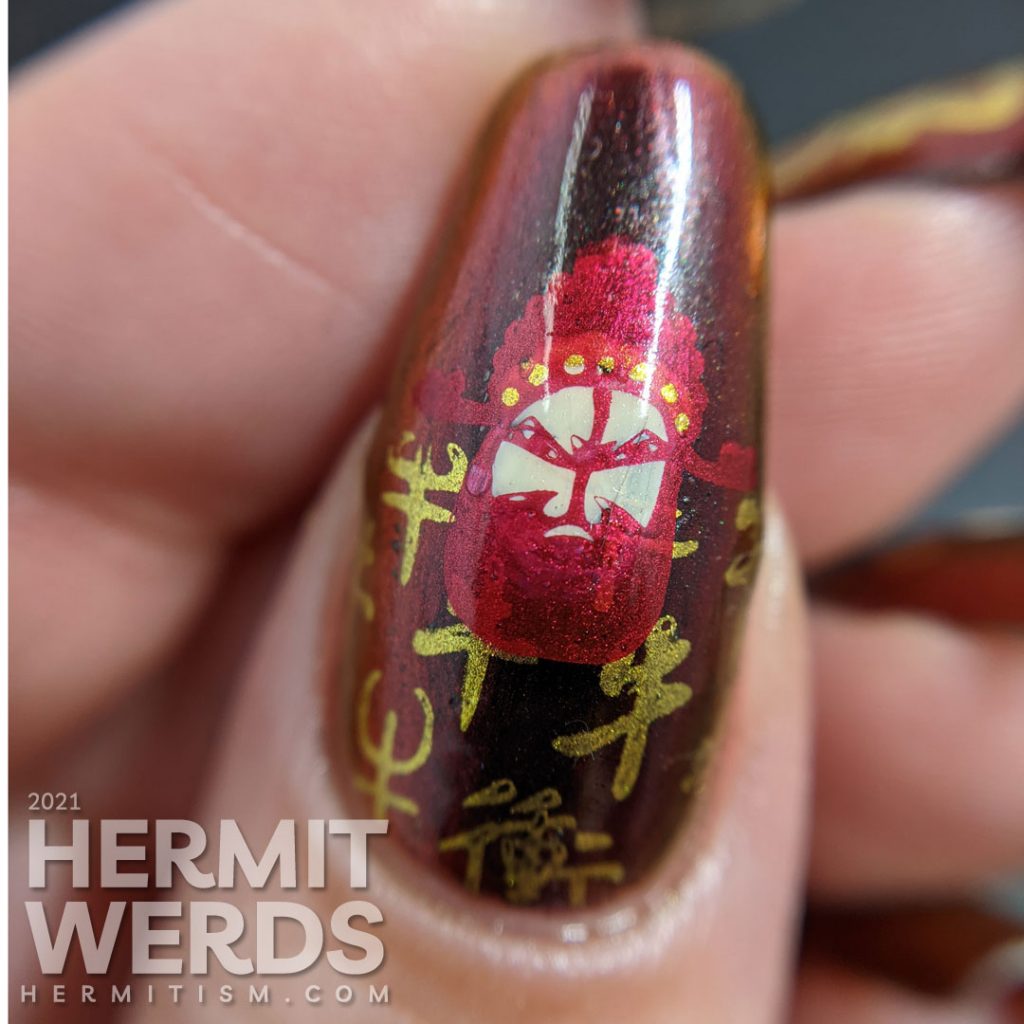 Year of the Ox nail art on a black/red/gold multichrome base with chibi Chinese opera performers, lanterns, and ox symbols.