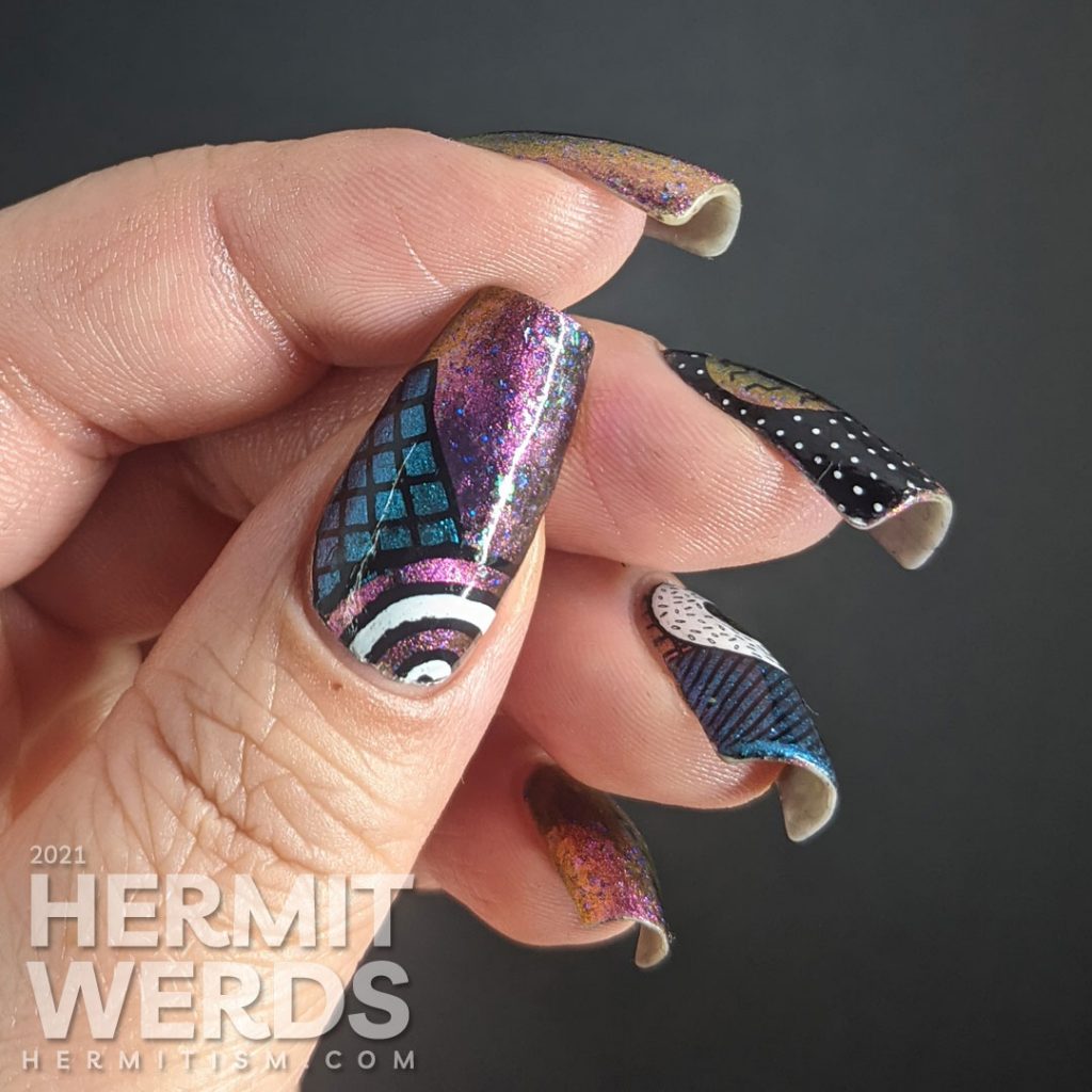 A gorgeous multichrome indie magnetic polish with abstract donut shapes and very 80s patterns stamped on top.