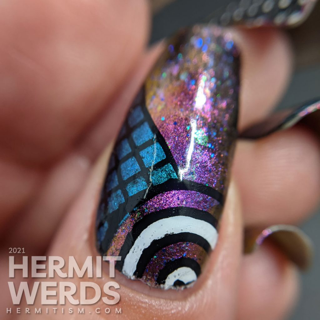 A gorgeous multichrome indie magnetic polish with abstract donut shapes and very 80s patterns stamped on top.