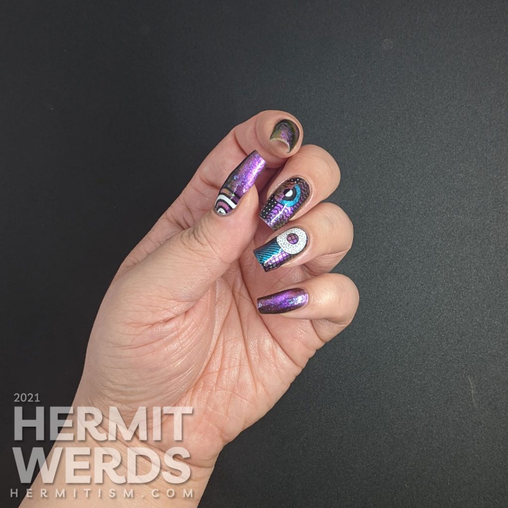 A gorgeous multichrome indie magnetic polish with abstract donut shapes and very 80s patterns stamped on top.