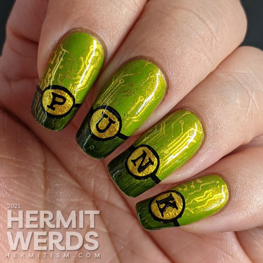 A green gold circuit board mani with "PUNK" French tips and a cyberpunk mohawked lady on the thumb.