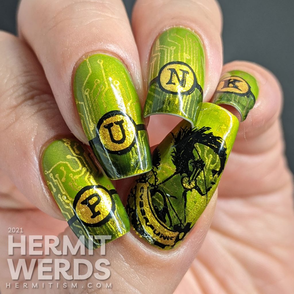 A green gold circuit board mani with "PUNK" French tips and a cyberpunk mohawked lady on the thumb.