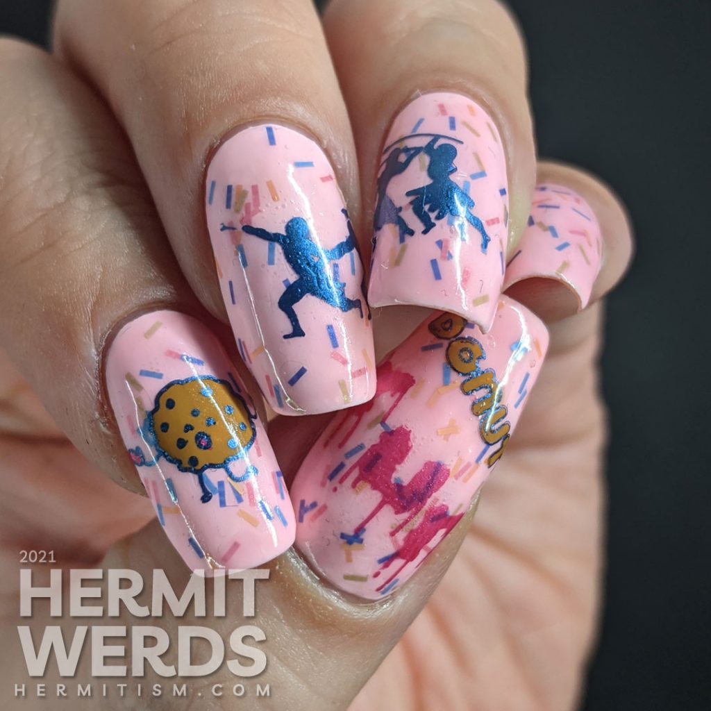 A sweet pink nail art using Sinful Colors' "Donut Even" with bar glitter sprinkles and a donut stamping decal running away from a group of hunters.