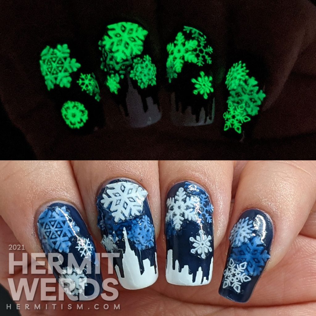 A pond mani with glow in the dark snowflake stickers and a white panoramic cityscape using a dark blue jelly polish.