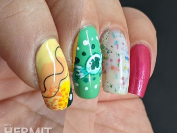 Three sweet nail art looks: yellow and orange heart balloons, green clover candies, and sweet blue and pink lollipops.