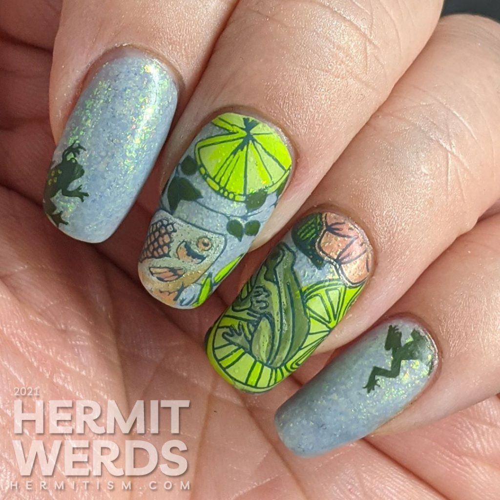 A soft blue-green mani of pond life, mostly frogs and one fish stamping decal with lily pads and other pond greenery.