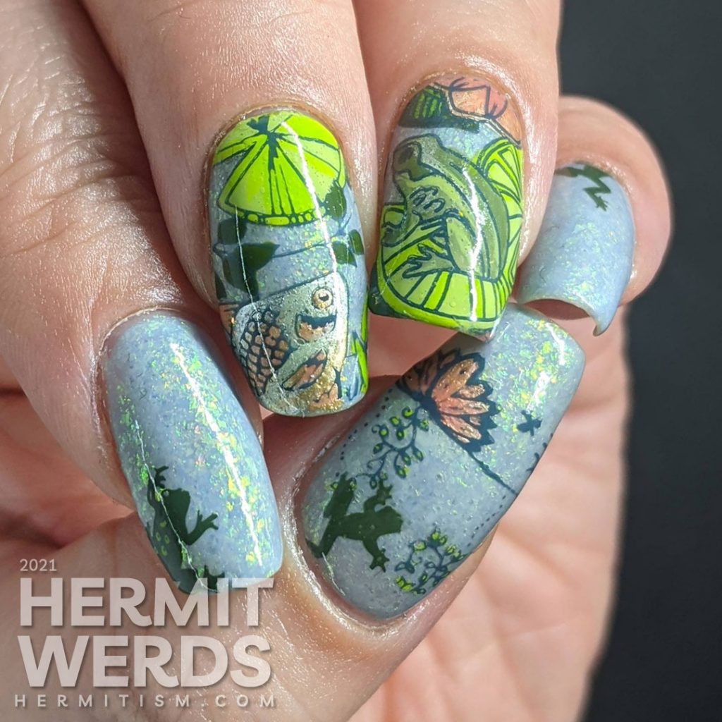 A soft blue-green mani of pond life, mostly frogs and one fish stamping decal with lily pads and other pond greenery.