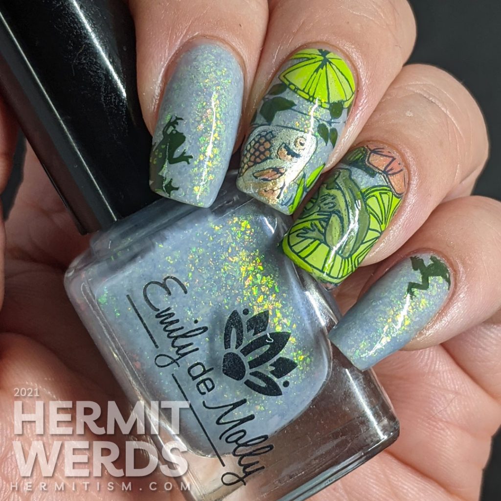 A soft blue-green mani of pond life, mostly frogs and one fish stamping decal with lily pads and other pond greenery.