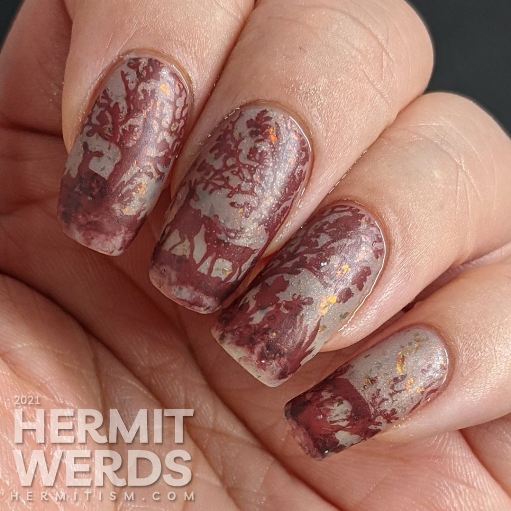 A vanishing mani using a brown thermal polish. A small herd of deer stamping images slowly appear as the nail art warms up.