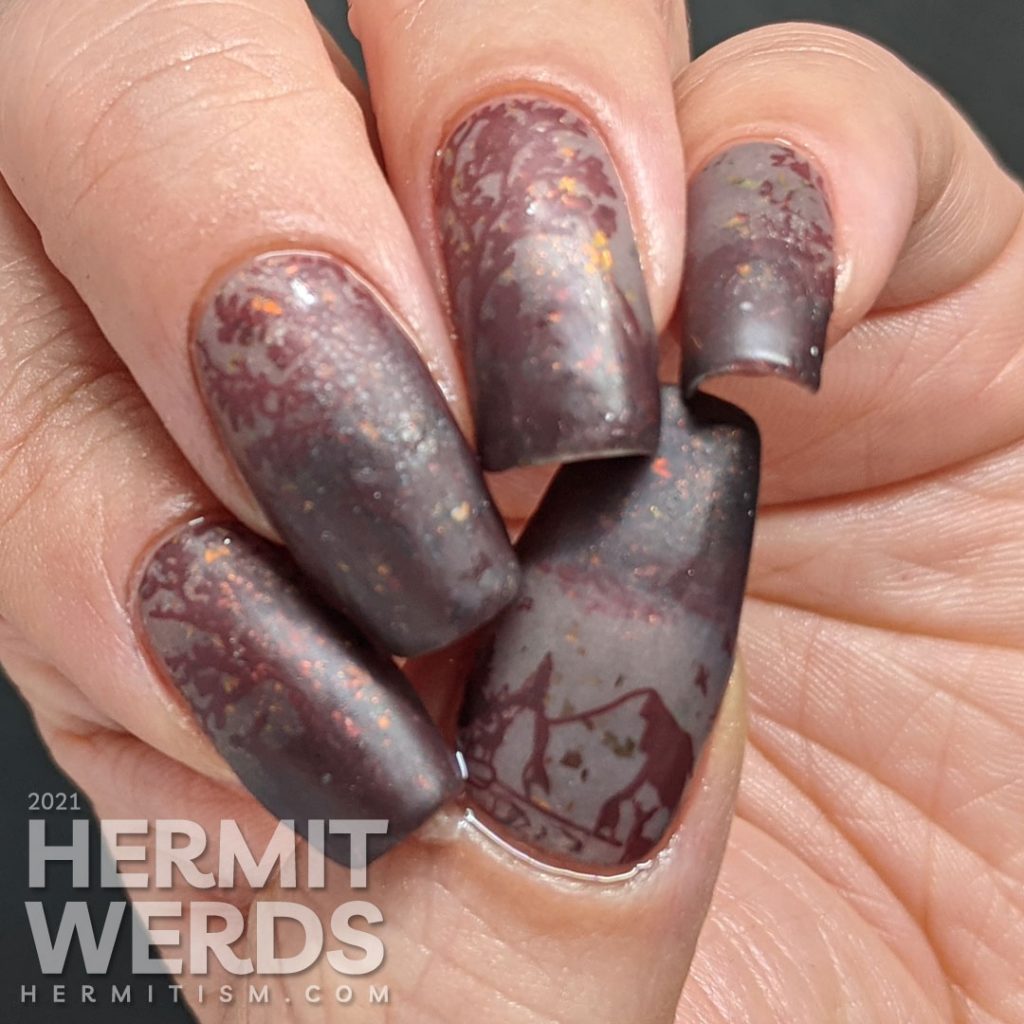 A vanishing mani using a brown thermal polish. A small herd of deer stamping images slowly appear as the nail art warms up.