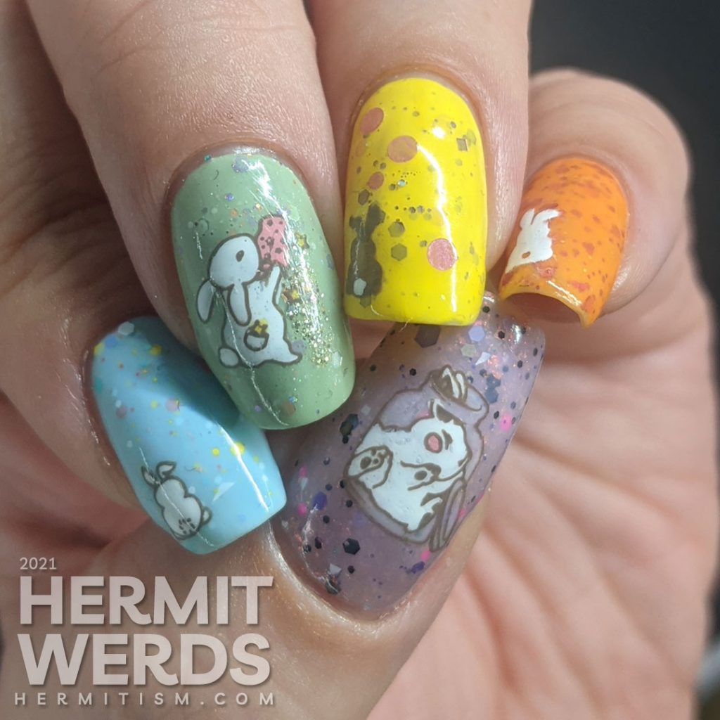 A pastel Easter crelly skittle nail design with a magical bunny, cute bunny butts, and a bunny in a jar for next year.
