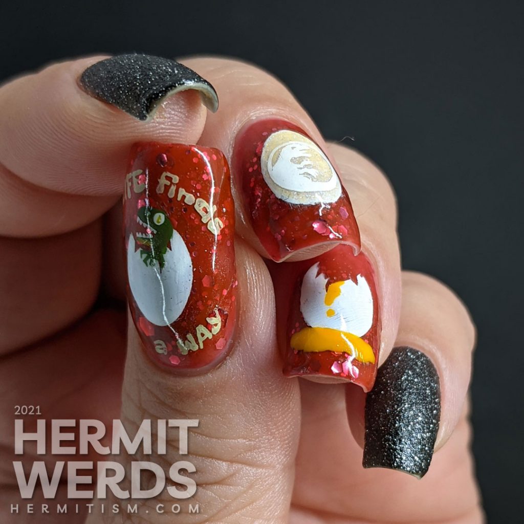 Nail art of dinosaur eggs (one broken with yolk, one glow in the dark with a baby dinosaur, and one just hatched) stamped on a blood red glitter filled base with two black texture glitter nails.