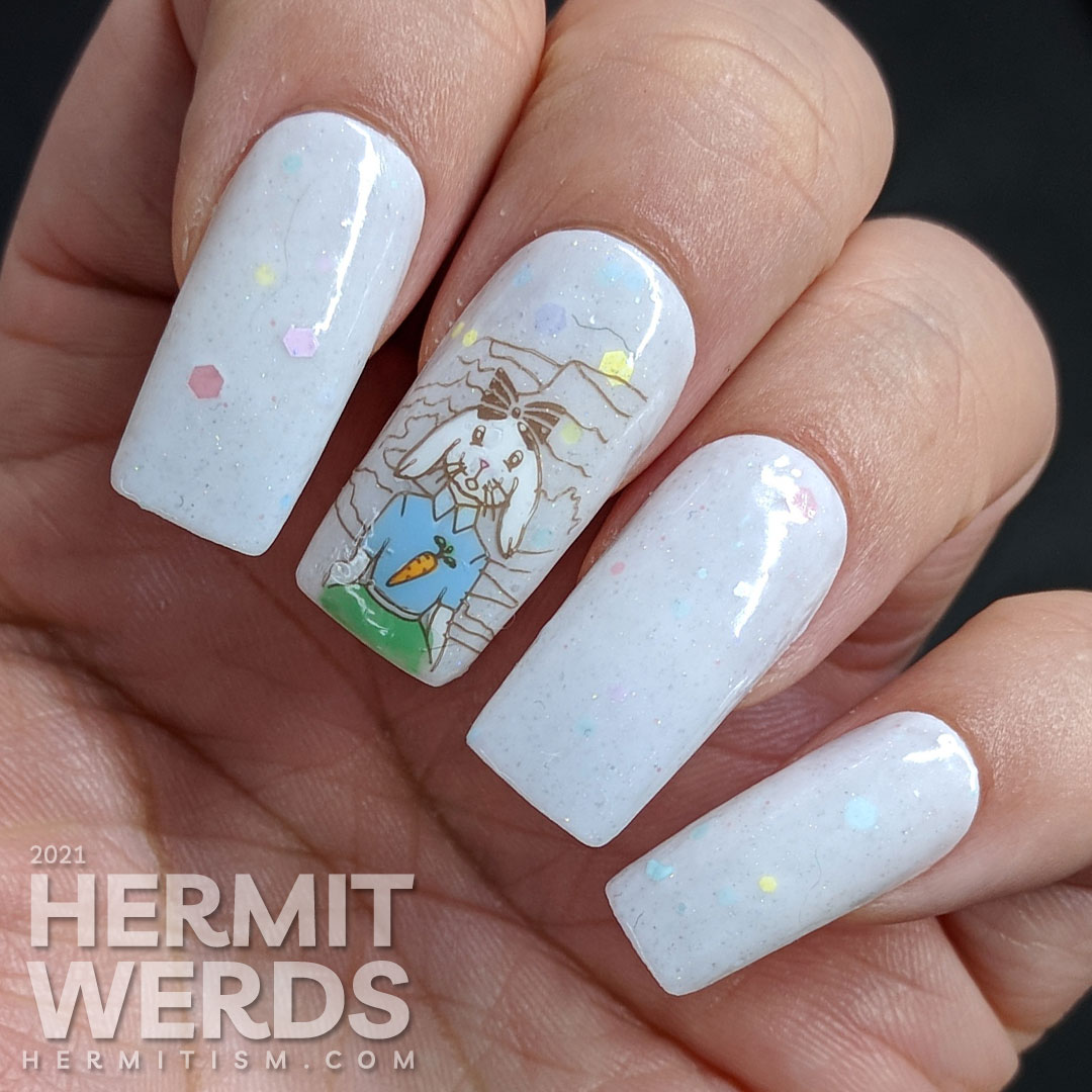 Easter nail art starting with a soft grey crelly with pastel glitters and a cute anthropomorphic bunny wearing a carrot t-shirt and carrots!