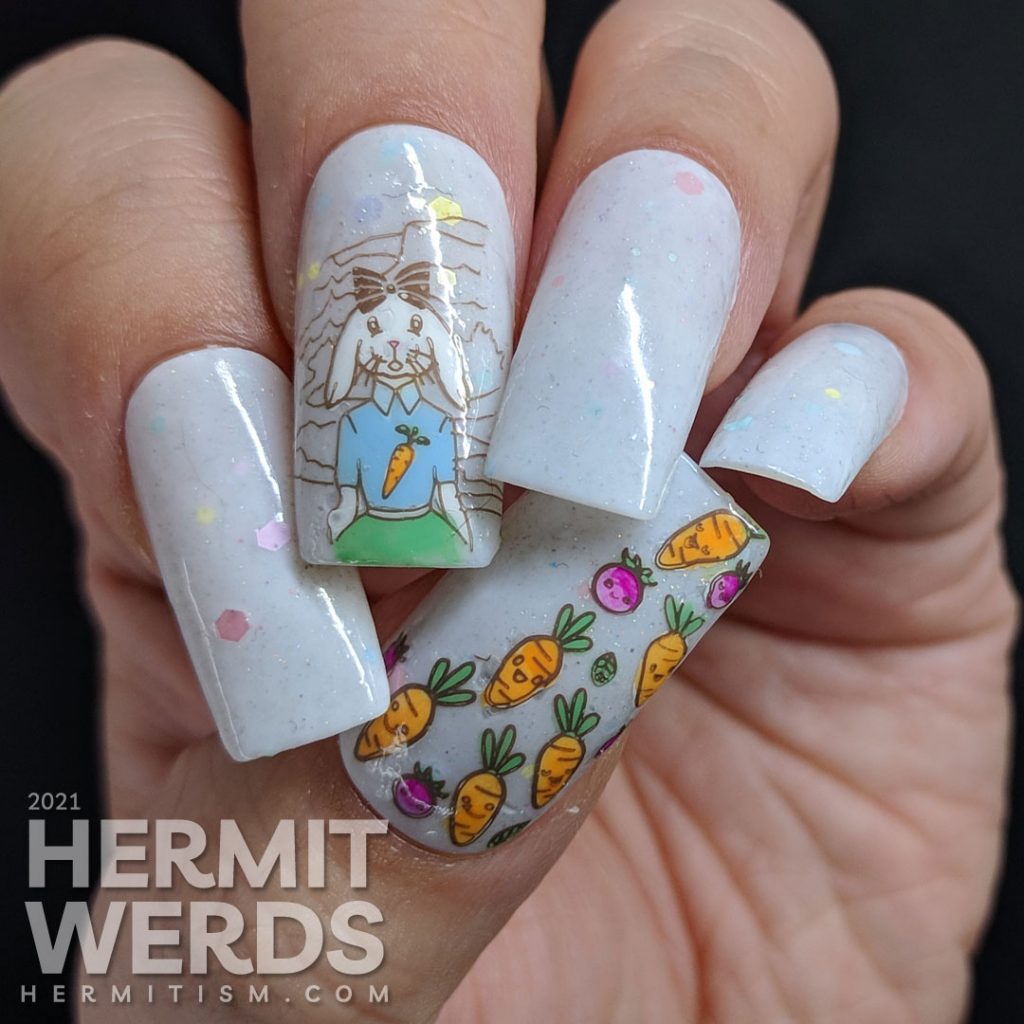 Easter nail art starting with a soft grey crelly with pastel glitters and a cute anthropomorphic bunny wearing a carrot t-shirt and carrots!