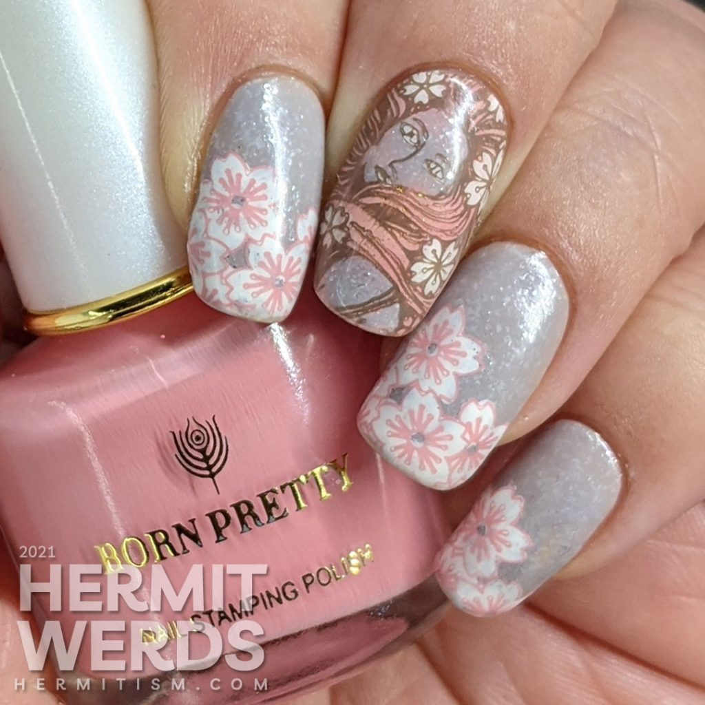 A soft grey nail art with stamping decals of sakura blossom French tips a pink-haired woman with more flowers and a blooming cherry tree.