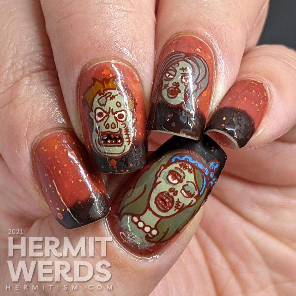 Zombie nail art with cartoon zombie head stamping decals and on a mustard/orange/brown tri-thermal base with orange and gold glitters.