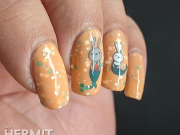 A bright pastel orange crelly with bunny mermaids (or bunnymaid) stamping decals with starfish and teal and white accents.