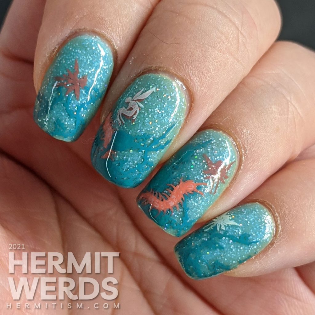 Thorny teal rose vines against a glow in the dark sparkly teal base with fairy and centipede reverse stamping decals.