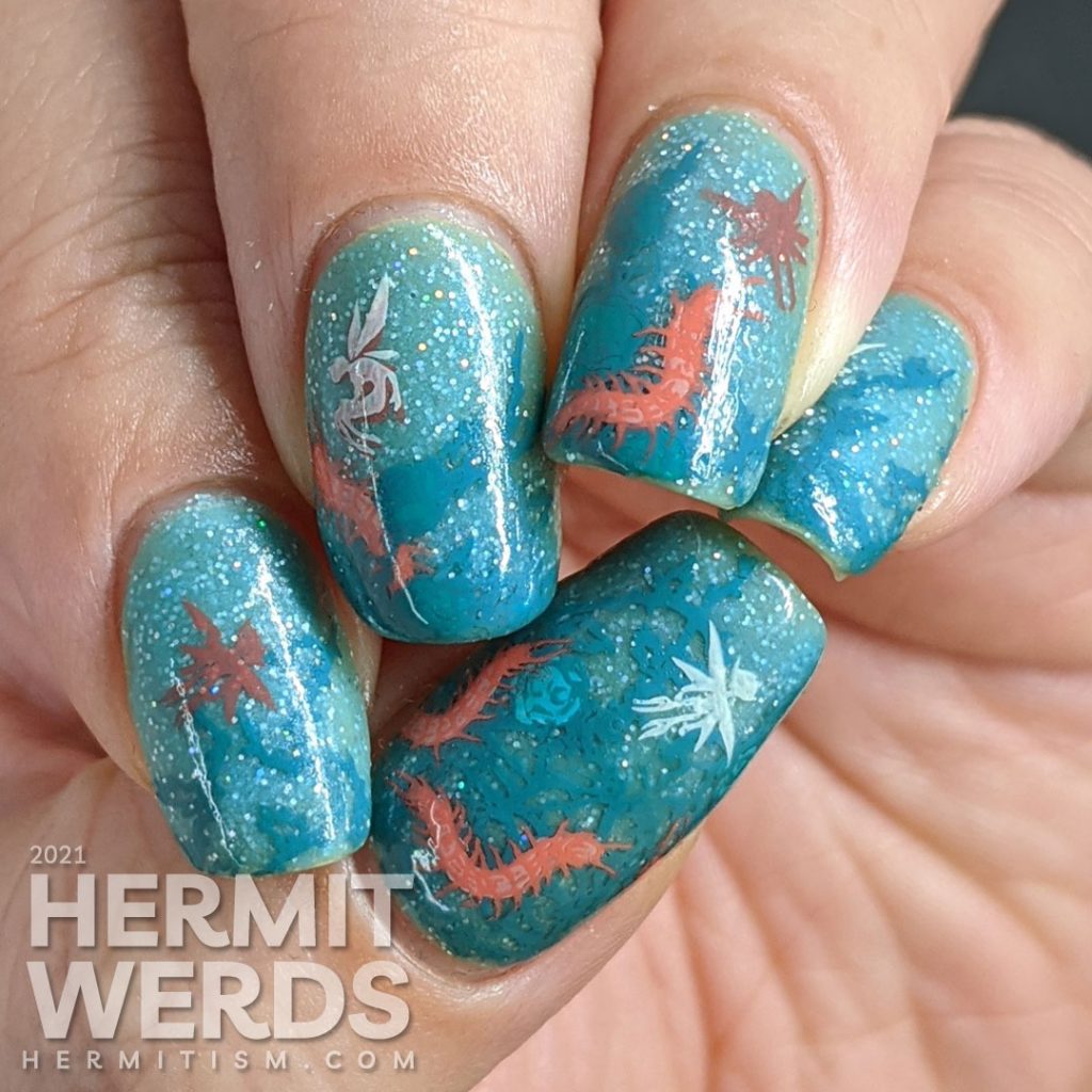 Thorny teal rose vines against a glow in the dark sparkly teal base with fairy and centipede reverse stamping decals.