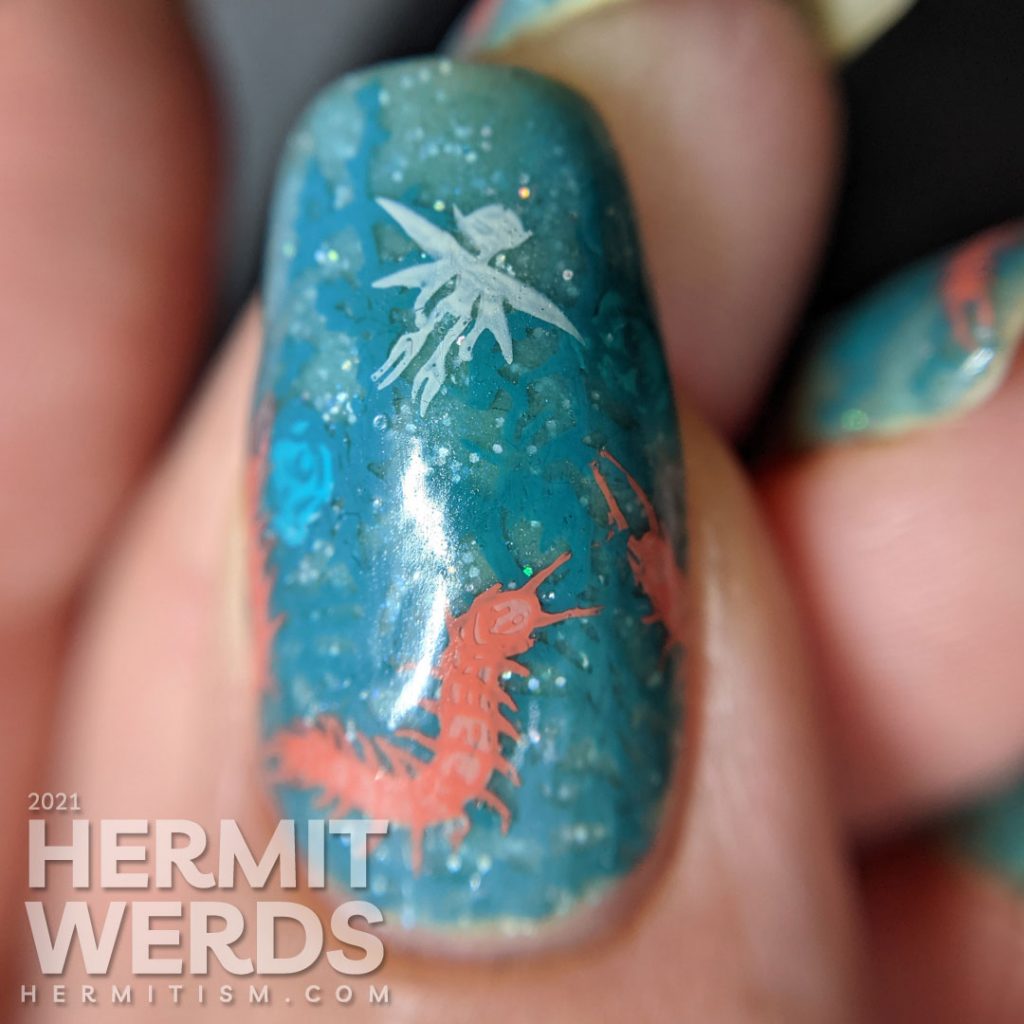 Thorny teal rose vines against a glow in the dark sparkly teal base with fairy and centipede reverse stamping decals.