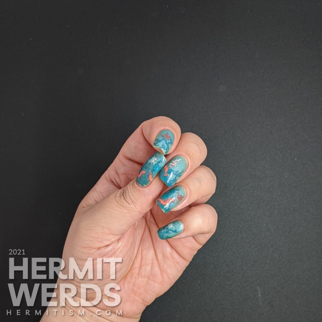 Thorny teal rose vines against a glow in the dark sparkly teal base with fairy and centipede reverse stamping decals.