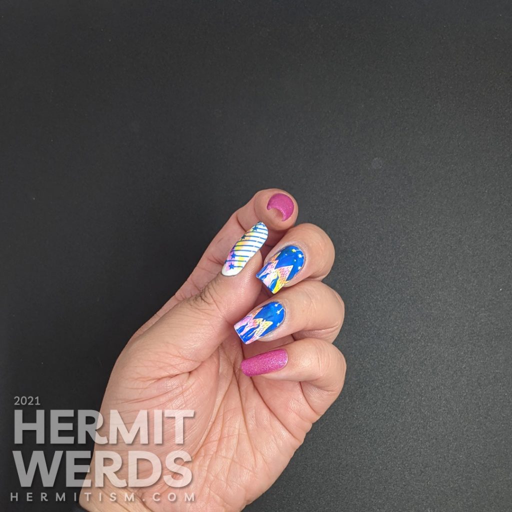 A neon cool nail art of penguins gazing up at a sky of shooting stars against an icey mountain background.