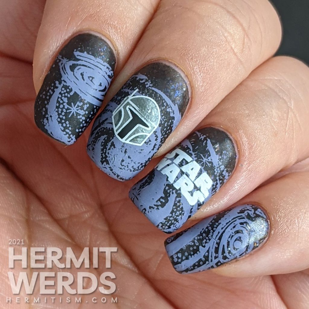 A black and purple Star Wars nail art with the Mandalorian's helm and Yoda silhouetted against a field of stars.
