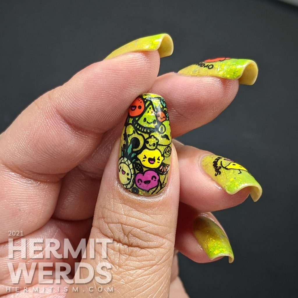 A yellow to bright green thermal polish with sweetly flattering orange and lemon stamping decals on top and more happy food on the thumb.