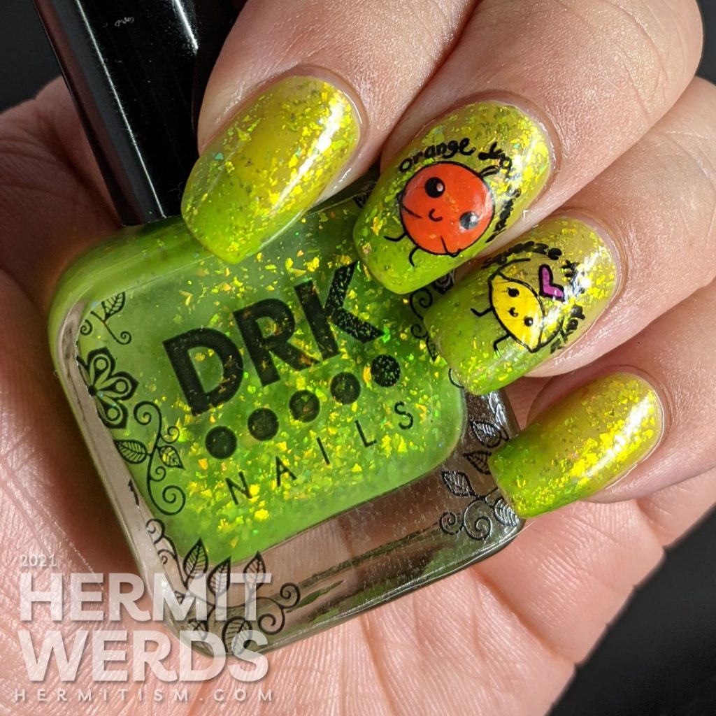 A yellow to bright green thermal polish with sweetly flattering orange and lemon stamping decals on top and more happy food on the thumb.