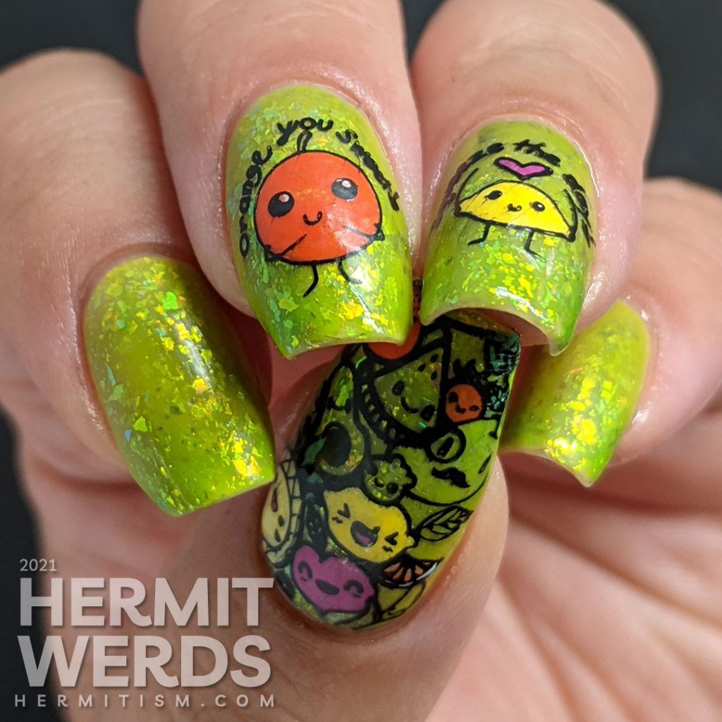 A yellow to bright green thermal polish with sweetly flattering orange and lemon stamping decals on top and more happy food on the thumb.