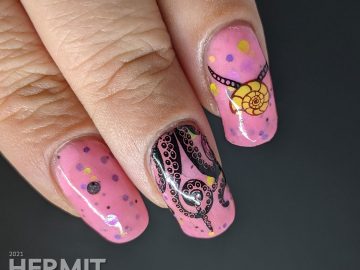 A pink glow in the dark crelly with Disney villain Ursula nail art complete with tentacles, shell necklace, and her attack on Eric's ship.