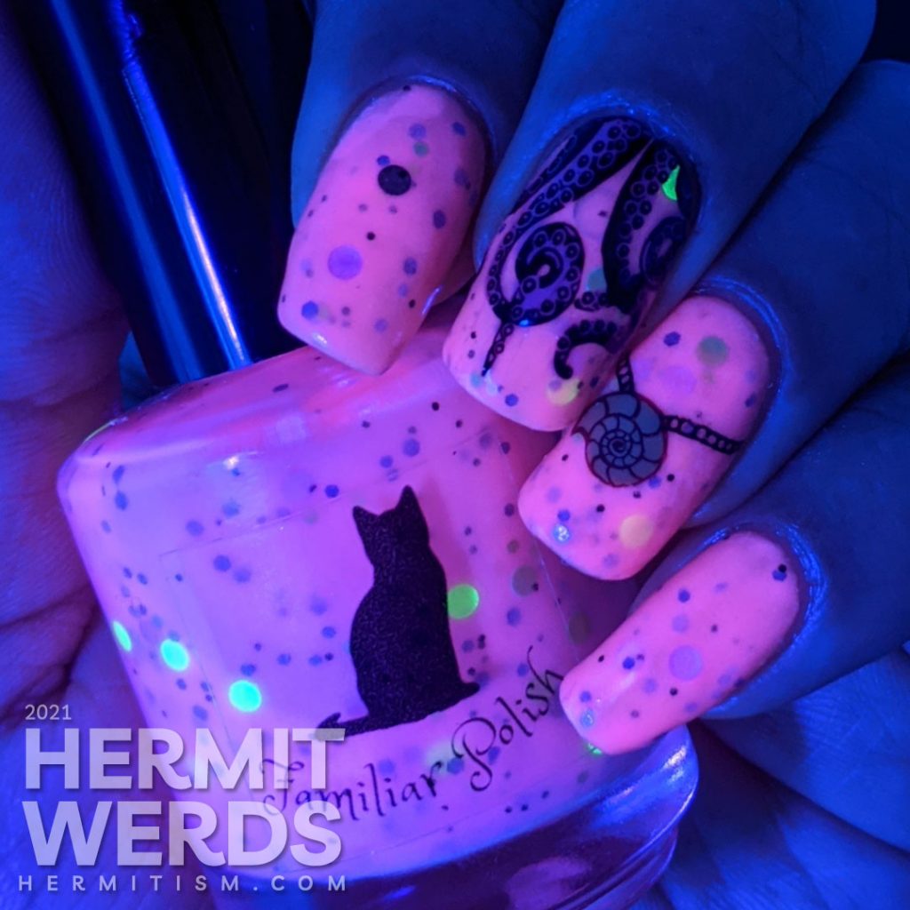 A pink glow in the dark crelly with Disney villain Ursula nail art complete with tentacles, shell necklace, and her attack on Eric's ship.