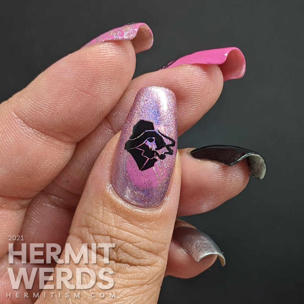 Nautical nail art in pink, black, and silver with lots of anchor stamping decals and a kiss of holographic nail polish.