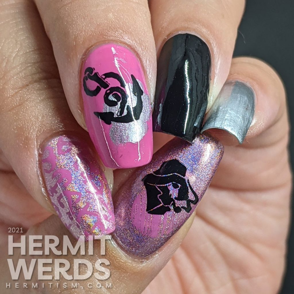 Nautical nail art in pink, black, and silver with lots of anchor stamping decals and a kiss of holographic nail polish.