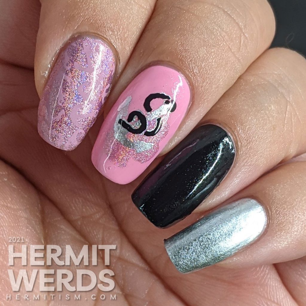 Nautical nail art in pink, black, and silver with lots of anchor stamping decals and a kiss of holographic nail polish.