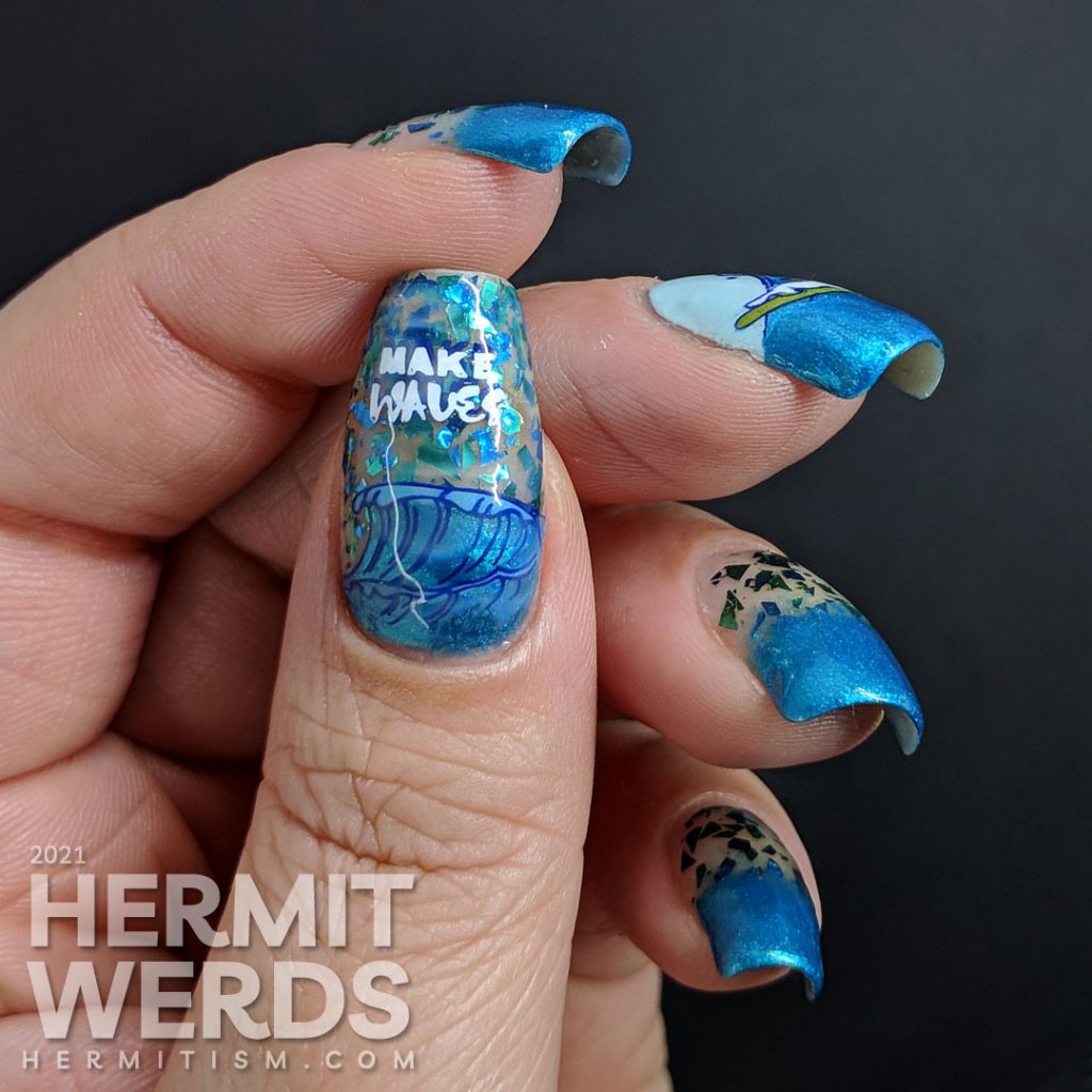 Shimmery blue and green ocean nail art with a stamping decal of a little white dog catching a wave/surfing.