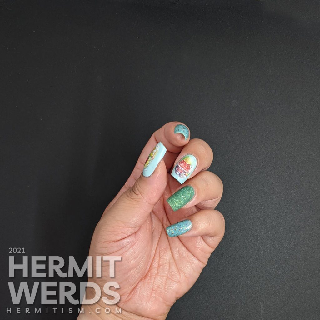 Teal/blue-green nail polishes with soft watercolor-like water decals of yummy ice cream dishes (sundae and milkshake) on top.