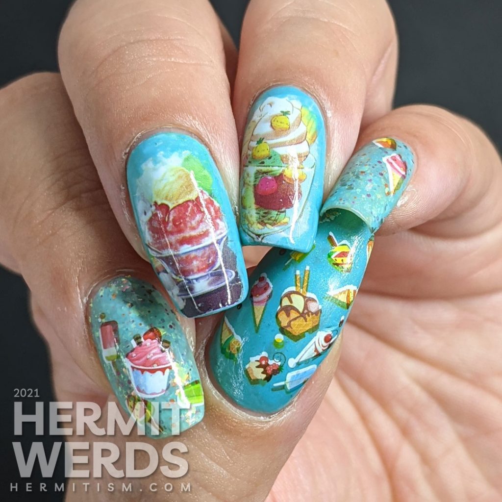 Teal/blue-green nail polishes with soft watercolor-like water decals of yummy ice cream dishes (sundae and milkshake) on top.