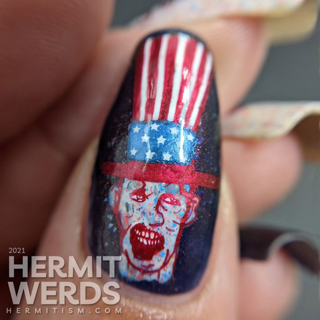 Patriotic nail art for the United States of Zombies with a red white and blue crelly and zombie stamping decals.