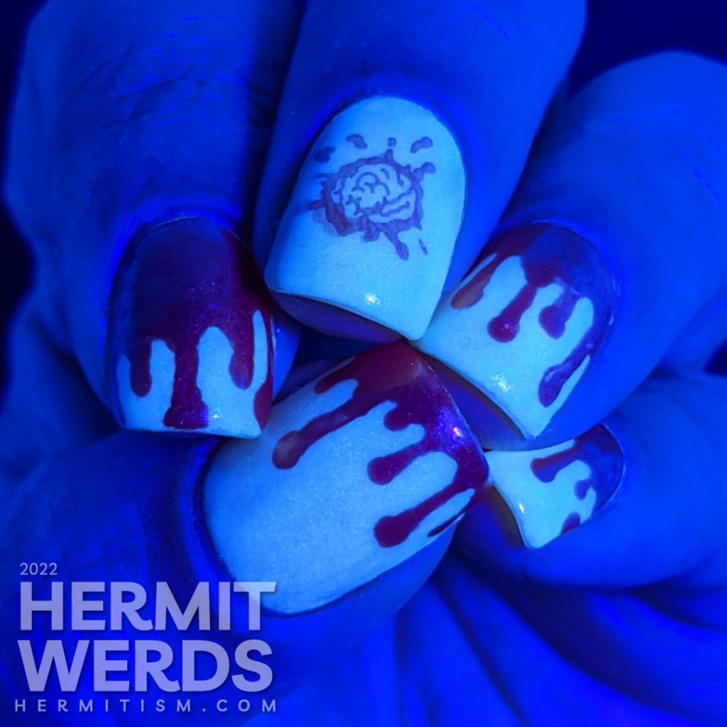 Orange and white bloody french tip drip nail art on a glow in the dark base with a bloody brain stamping decal.