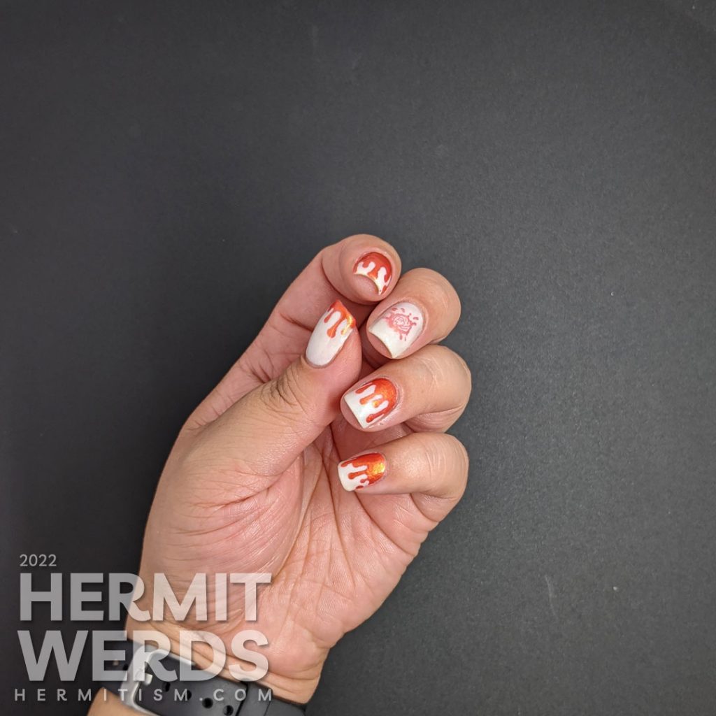 Orange and white bloody french tip drip nail art on a glow in the dark base with a bloody brain stamping decal.