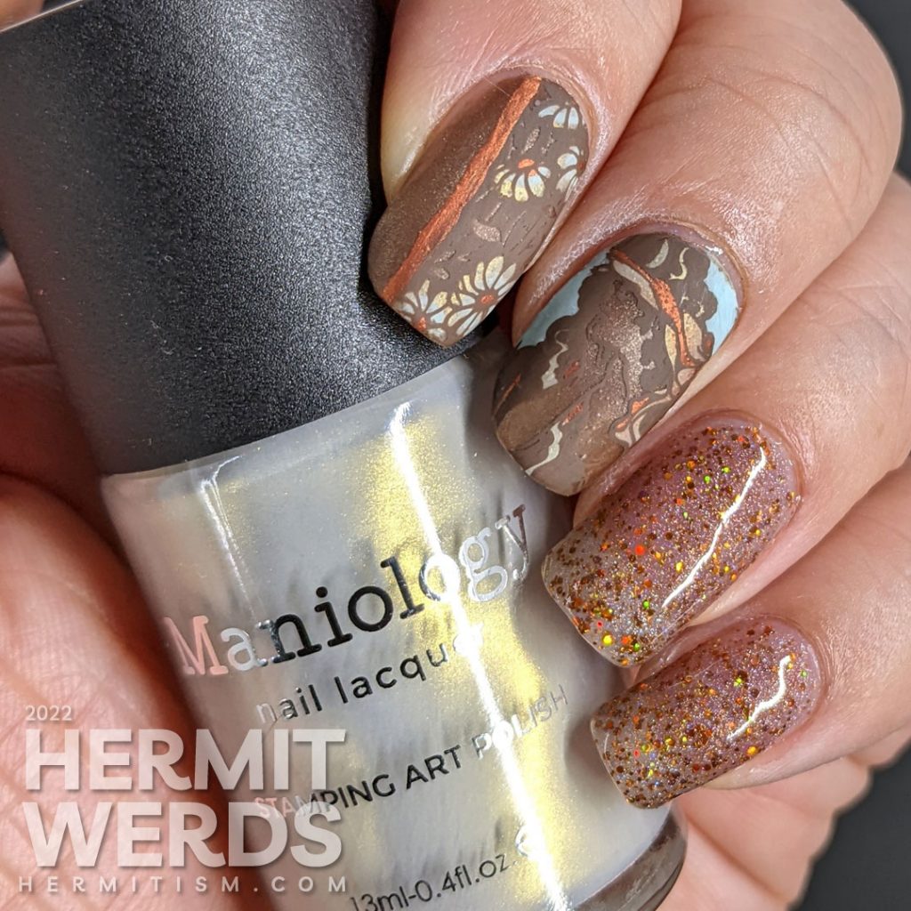 A soft, golden brown art nouveau nail art with a beautiful art nouveau woman, florals, and accompanying sparkly accent nails.