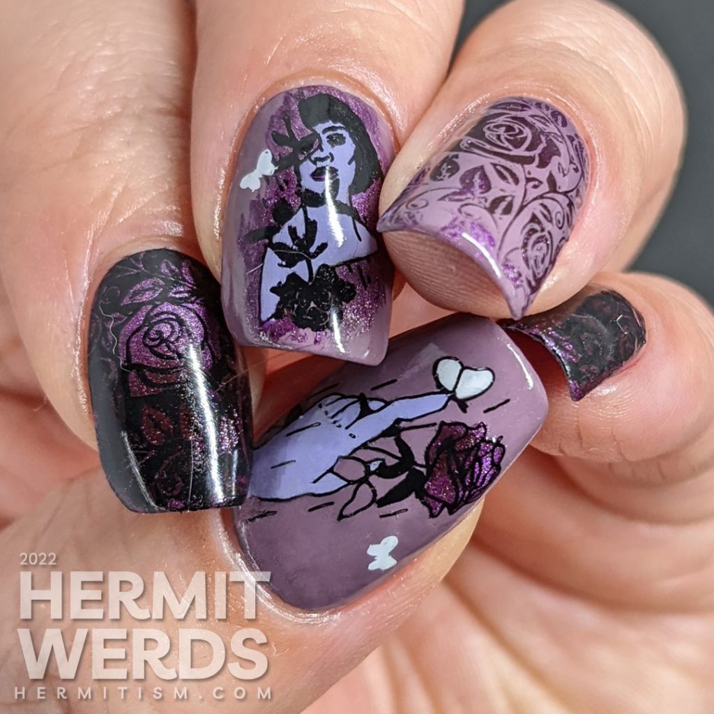 Dramatic purple rose nail art with a magnetic purple polish peeking out from negative space rose patterns and token butterflies.