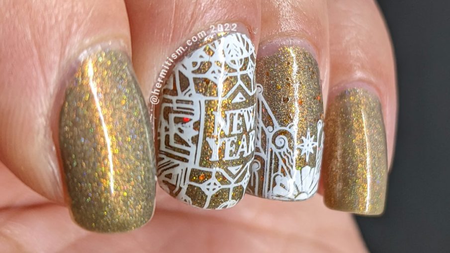 New Years nail art with simple art deco nail stamping on a smoky holographic golden brown base.