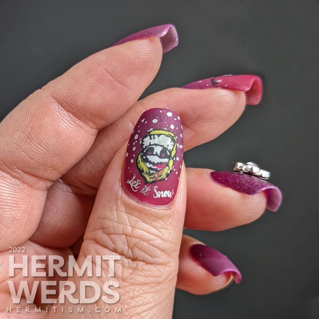 Beautiful berry mani with a textured accent nail + silver snowflake nail charm offset by stamping decals of scary bloody snowmen.